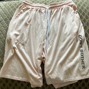 Pink shorts with Don’t Bother on Side